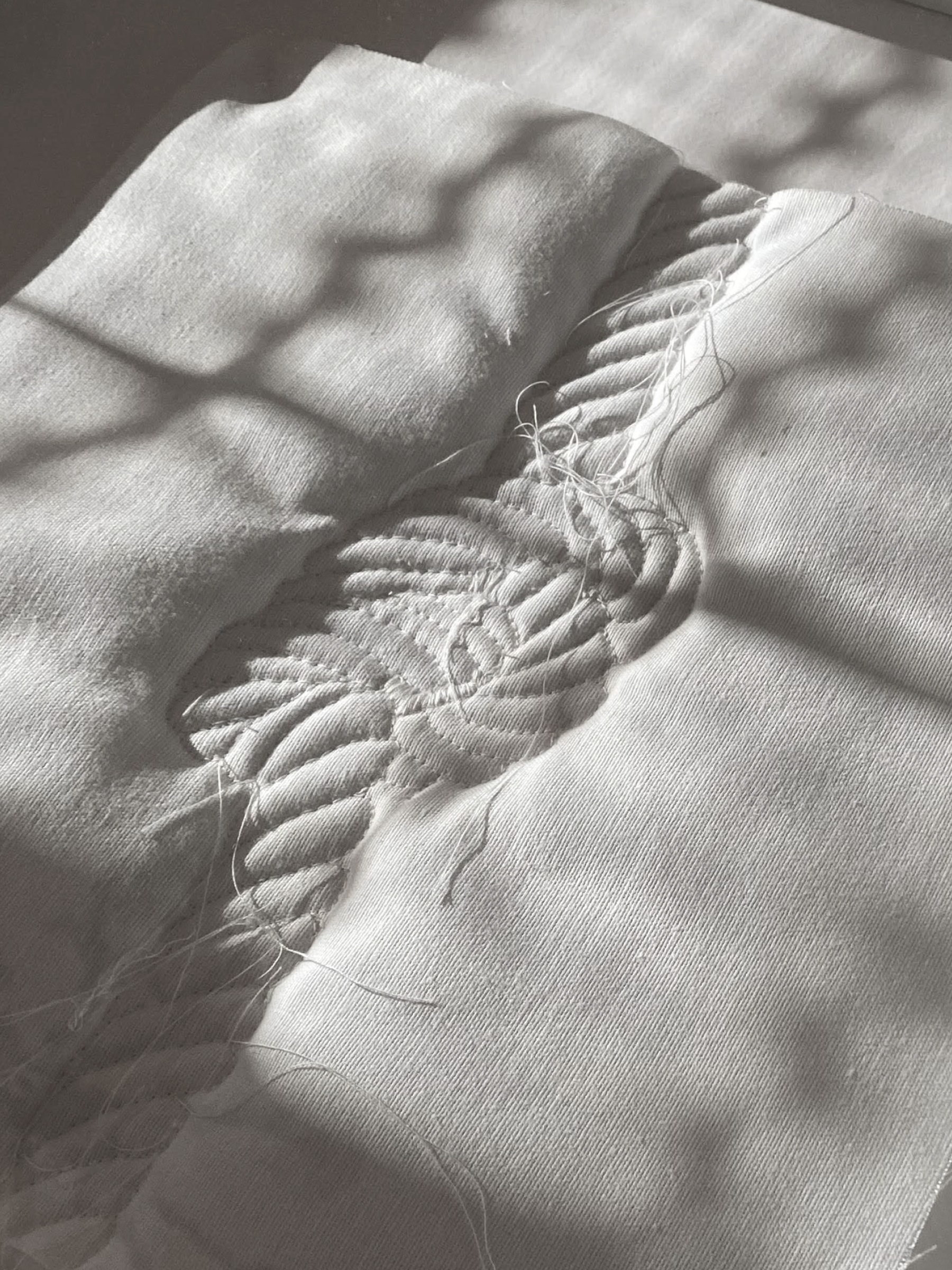Textile white artwork with embroidered rope displayed at the 26th Labin Art Festival