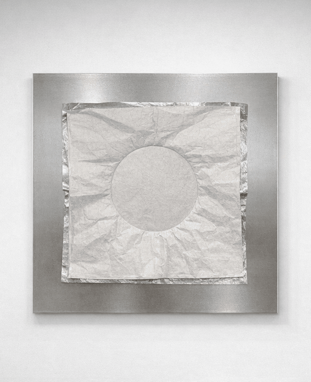 A layered artwork combining aluminum surface, Tyvek fabric, and padding, unified through white thread hand stitching. 